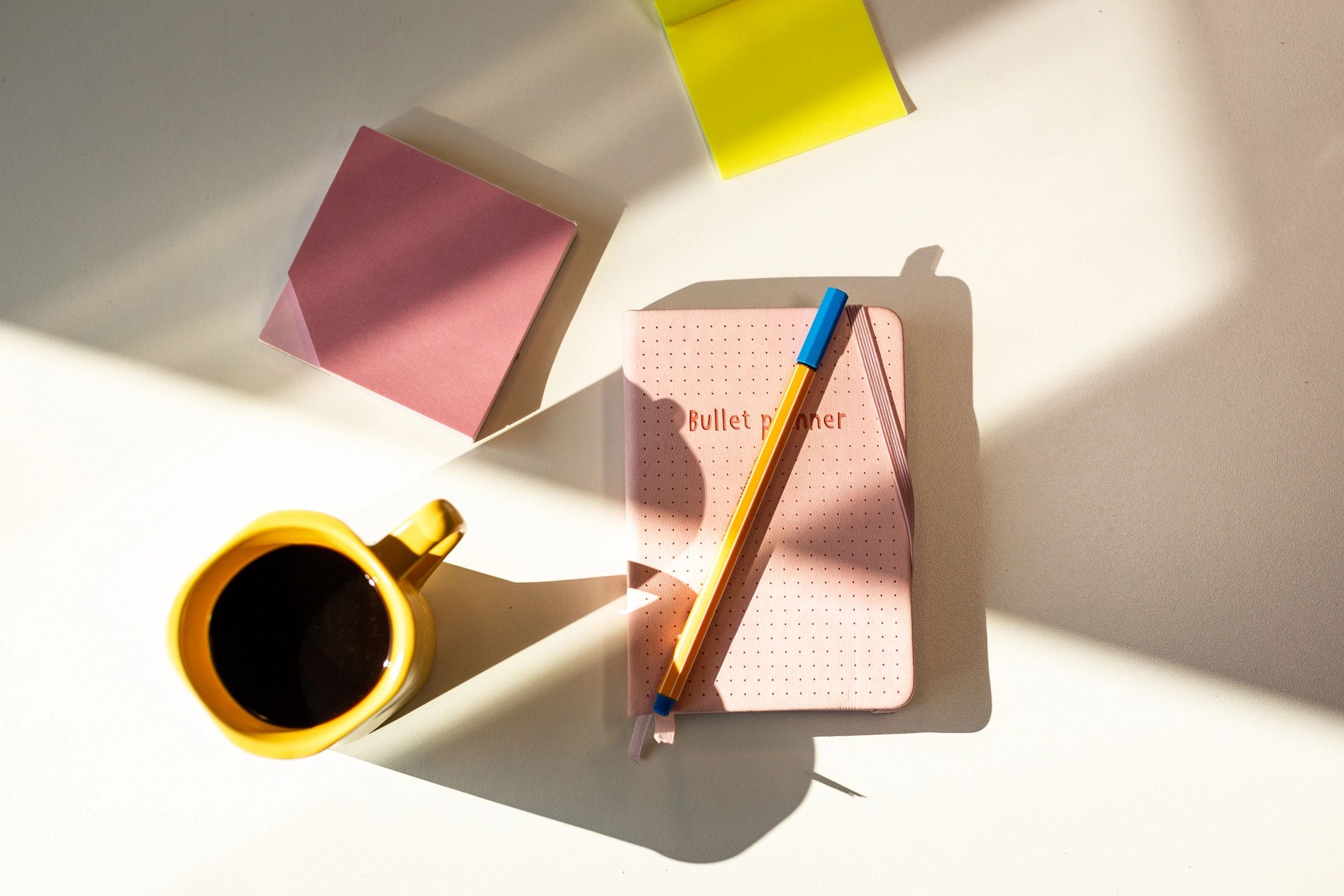 Notebook and coffee arranged for clue solving and journaling