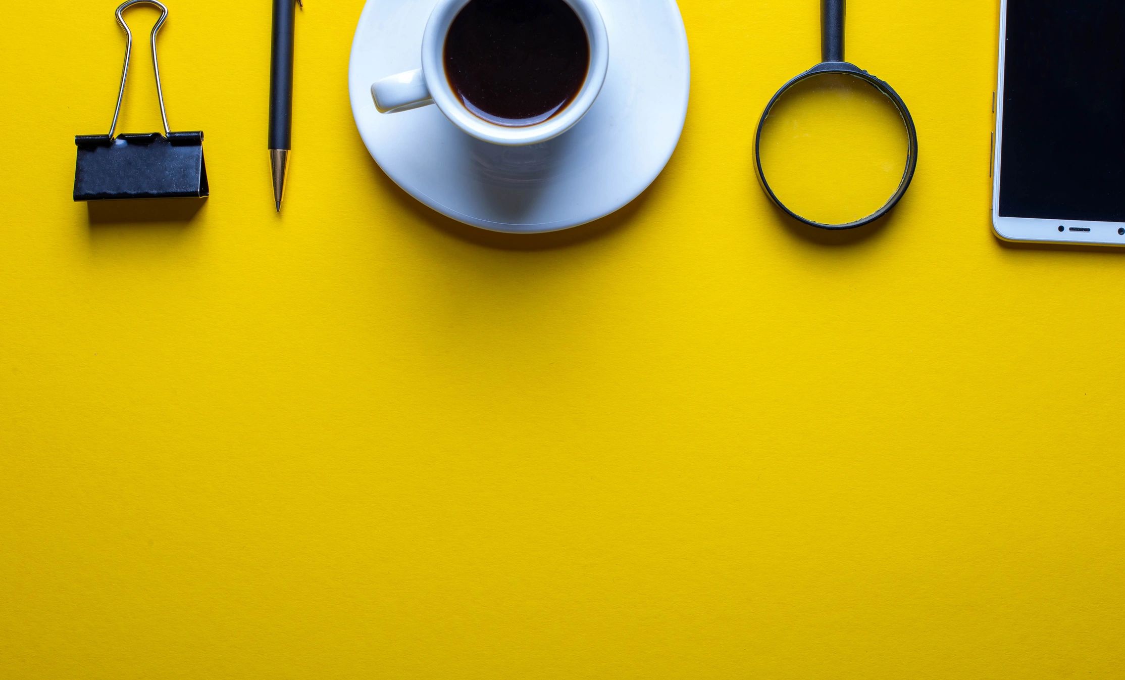 Magnifying glass and desk items suggesting puzzle solving