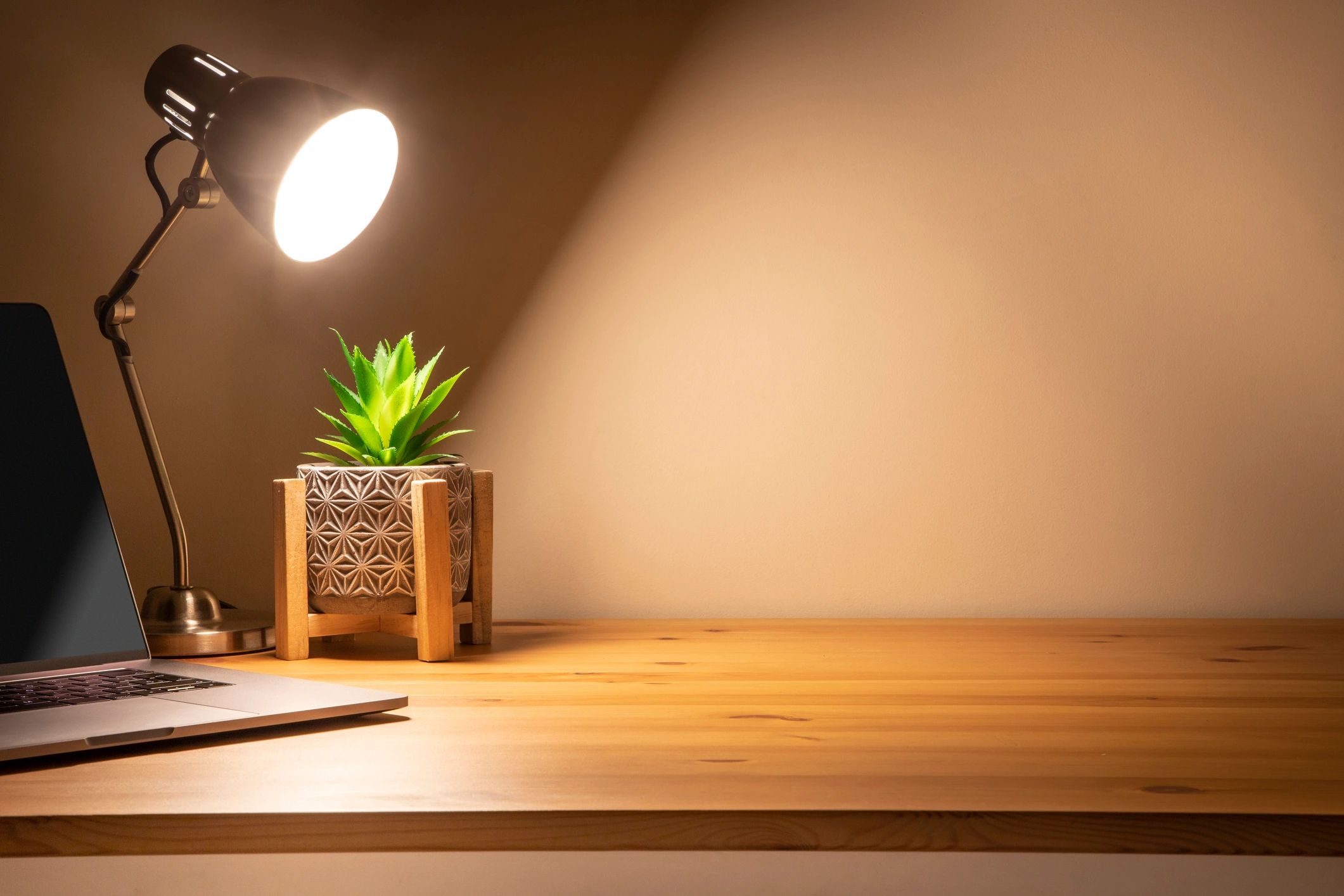 Warm wooden desk at night creating a cozy mystery atmosphere