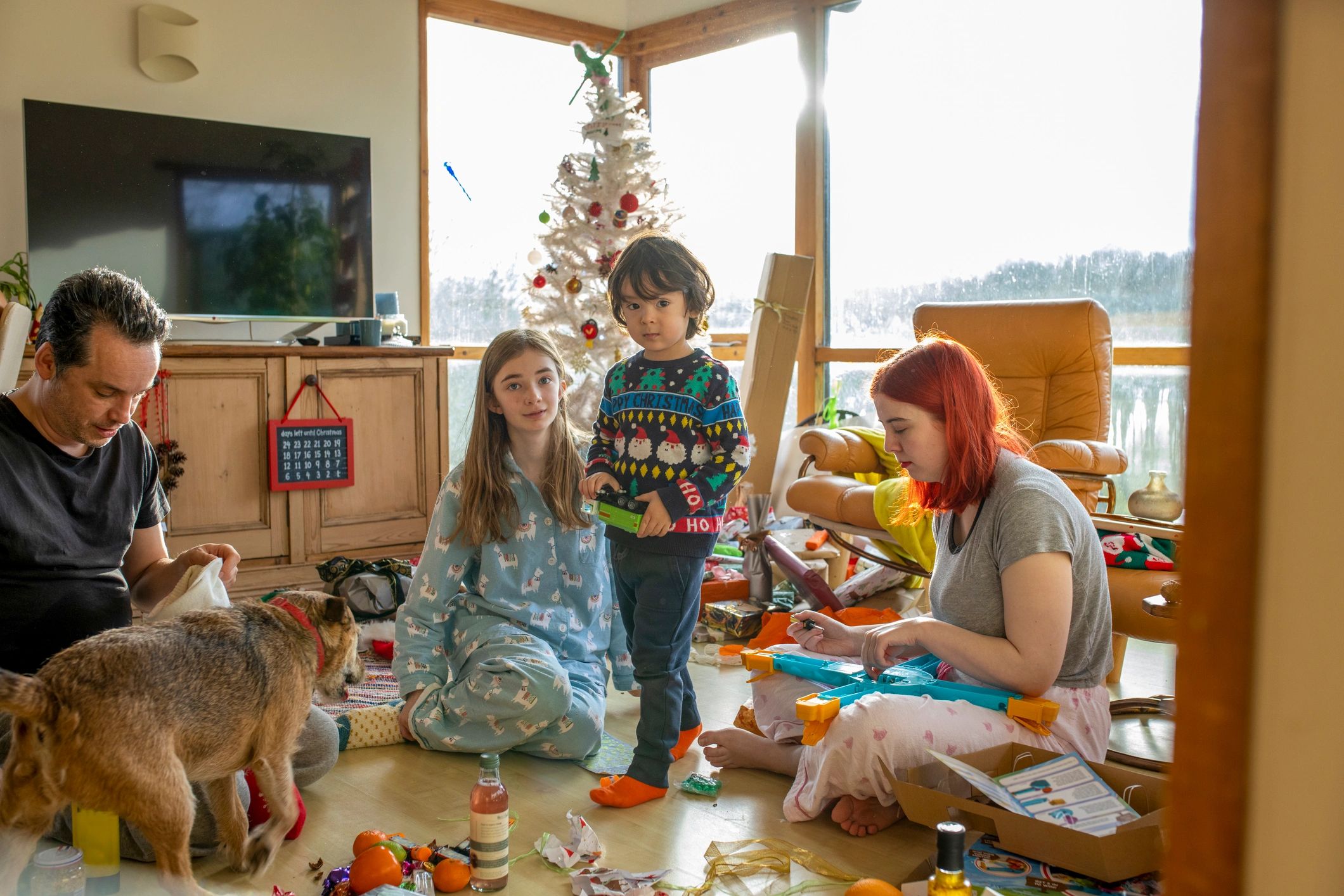 Family gathered in a cozy living room for a festive game night