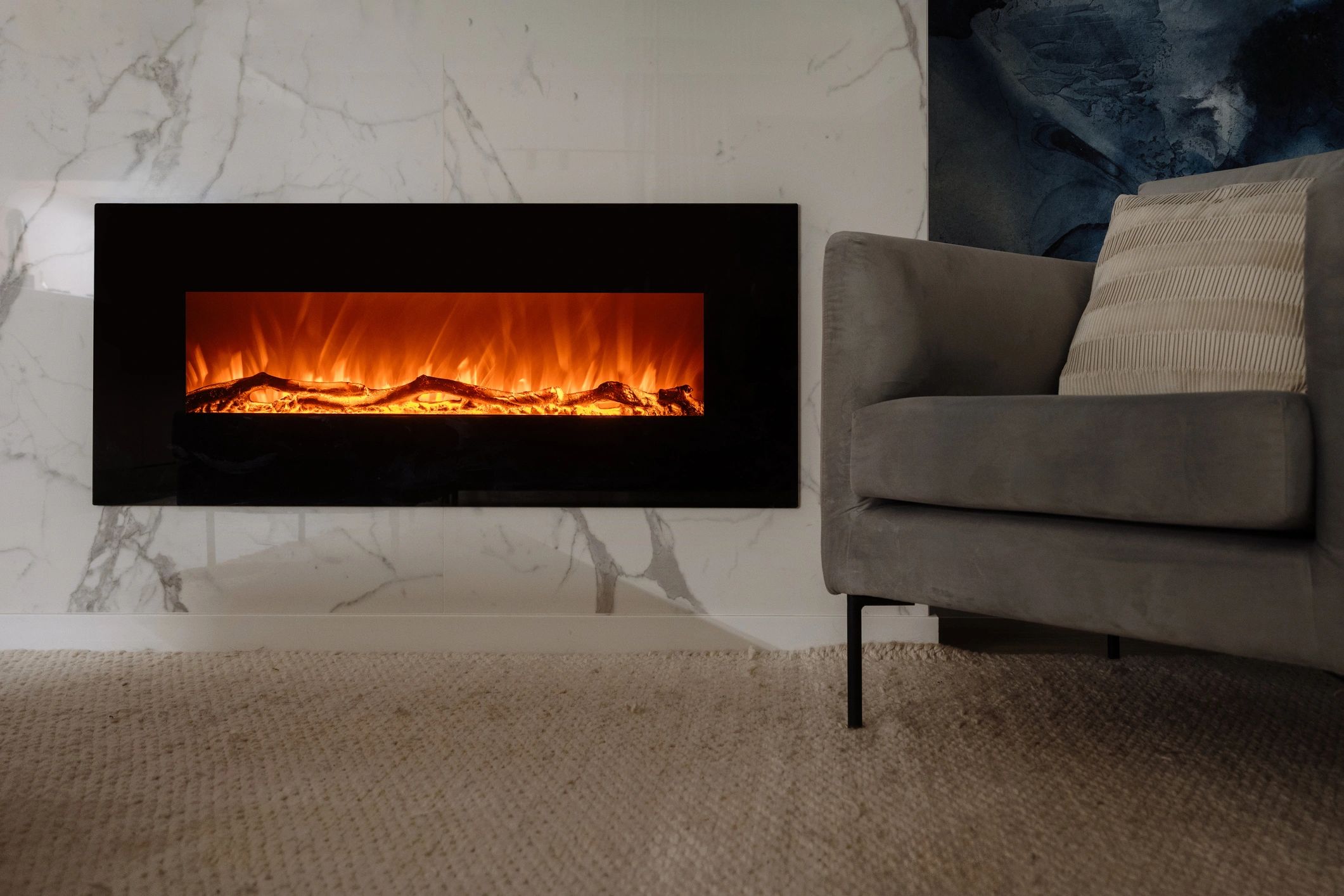 Warm living room with fireplace and inviting chair for a cozy evening