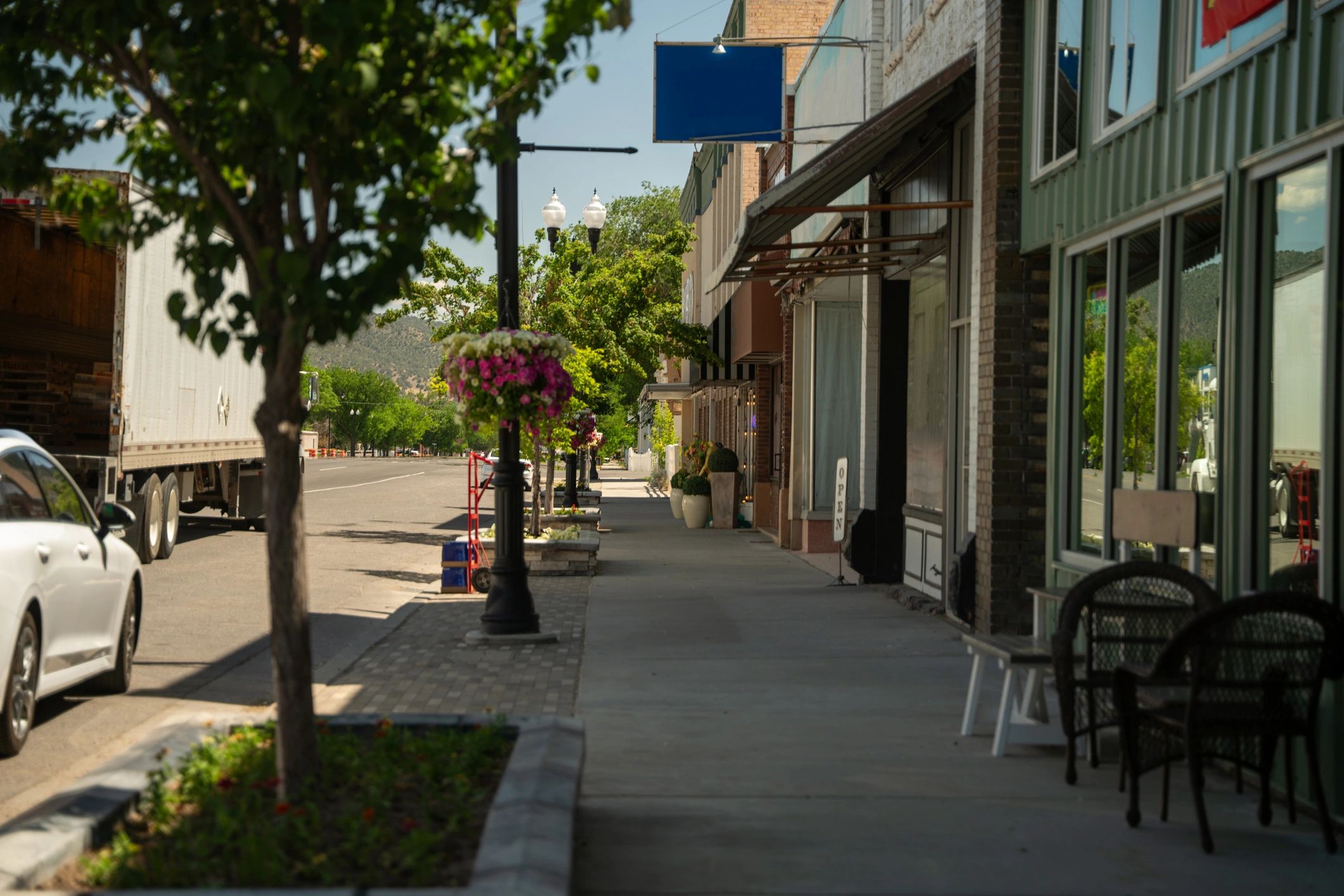 Charming small-town street with storefronts and a cozy mystery atmosphere