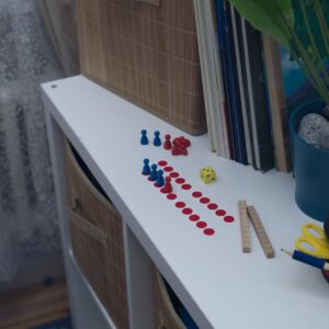 Game cards and pieces arranged for a printable mystery night activity