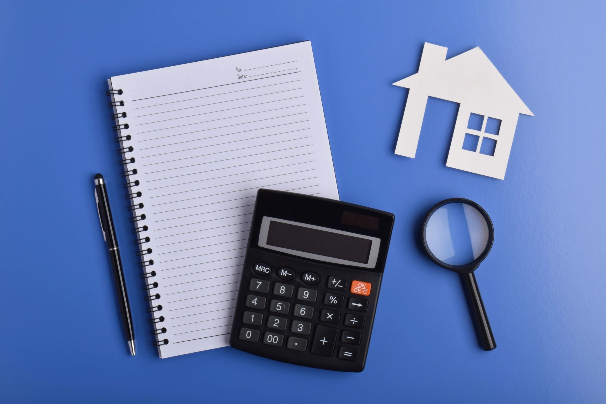 Notebook and magnifying glass for planning clues