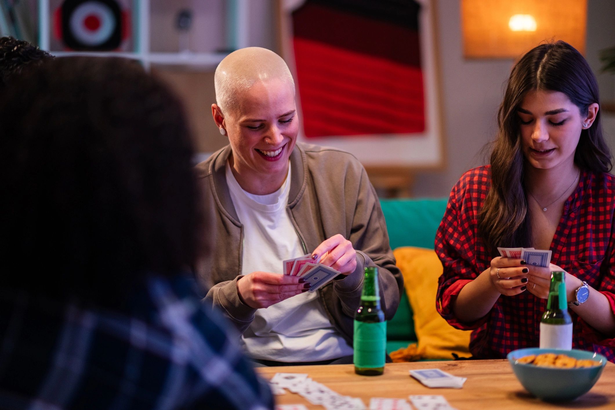Friends enjoying a relaxed tabletop game night together